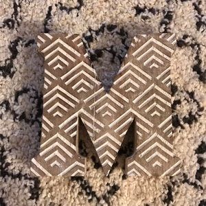 ‘M’ initial block